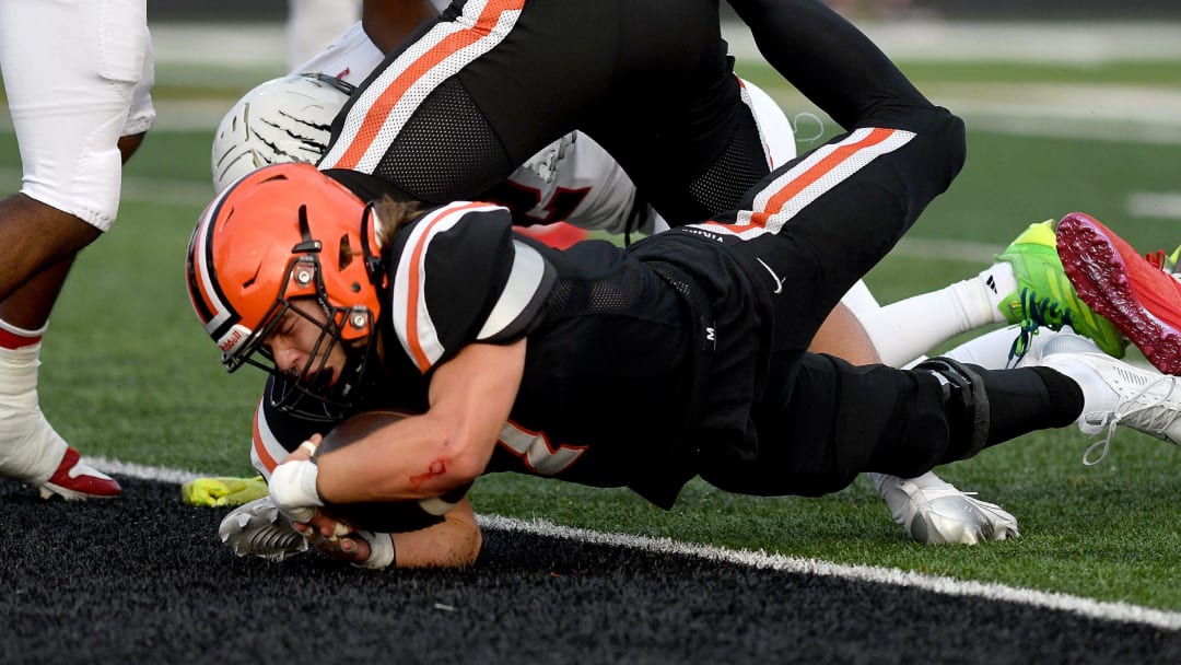 Hoover running back AJ Dolph take the ball in for a touchdown in the first quarter of Buchtel at Hoover football. Friday, August 23, 2024.