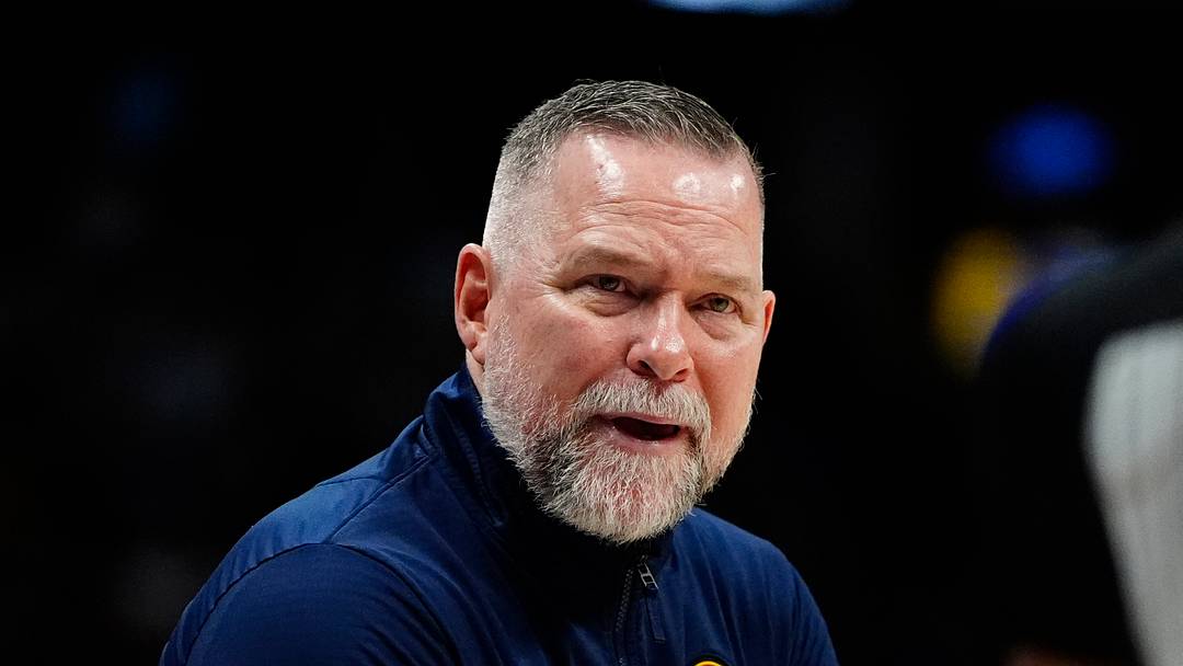 Apr 6, 2025; Denver, Colorado, USA; Denver Nuggets head coach Michael Malone reacts towards referee Danielle Scott (87) in the second half against the Indiana Pacers at Ball Arena. Mandatory Credit: Ron Chenoy-Imagn Images