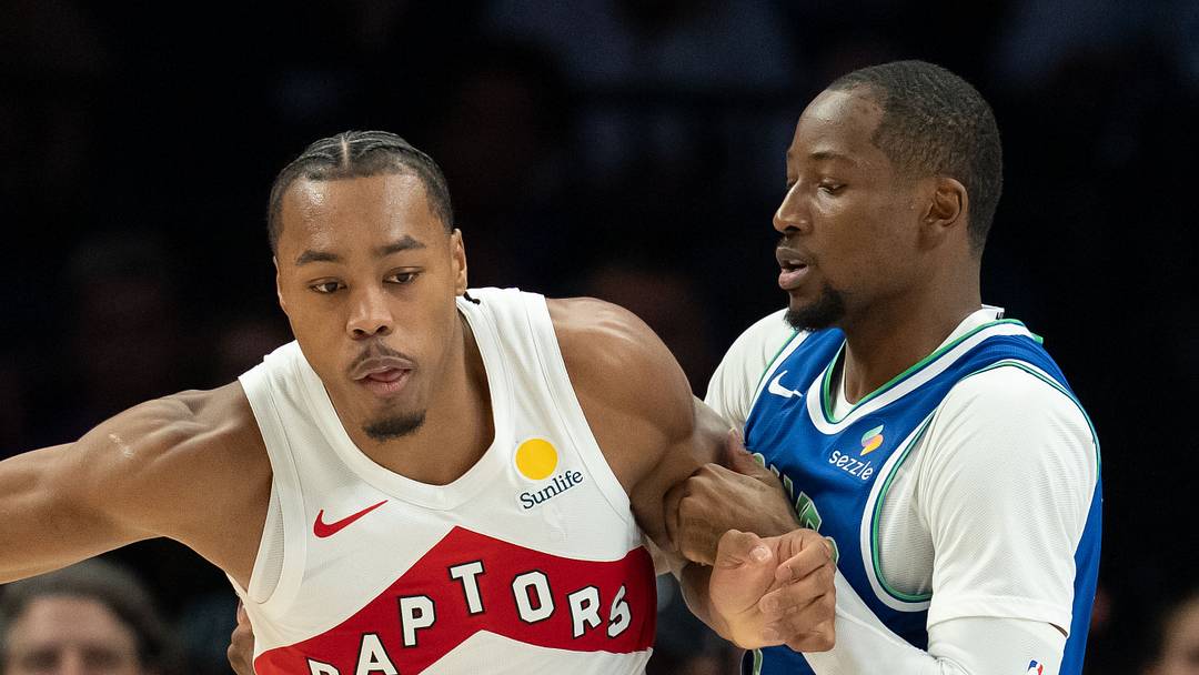 Oct 25, 2026; Minneapolis, Minnesota, USA;  Toronto Raptors forward Scottie Barnes (4) dribbles the ball as Minnesota Timberwolves forward Jonathan Kuminga (24) played defense in the first half at Target Center.  Mandatory Credit: Jesse Johnson-Imagn Images