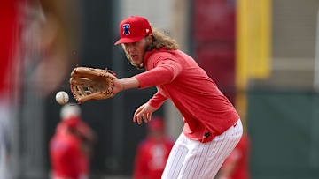 Feb 19, 2025; Clearwater, FL, USA; Philadelphia Phillies third base Alec Bohm (28) takes fielding practice during spring training workouts at BayCare Ballpark