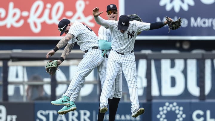 Aug 25, 2024; Bronx, New York, USA;  New York Yankees outfielders Alex Verdugo (24), Aaron Judge (99), and Juan Soto (22) celebrate after defeating the Colorado Rockies at Yankee Stadium. Mandatory Credit: Wendell Cruz-USA TODAY Sports