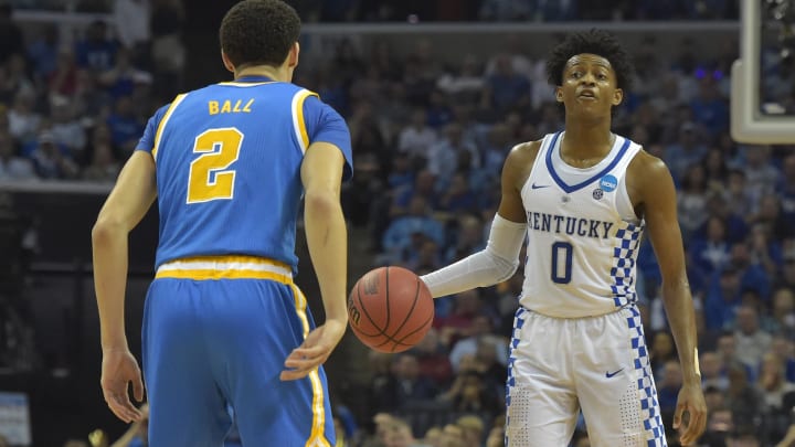 Mar 24, 2017; Memphis, TN, USA; Kentucky Wildcats guard De'Aaron Fox (0) looks to pass the ball against UCLA Bruins guard Lonzo Ball (2) in the second half during the semifinals of the South Regional of the 2017 NCAA Tournament at FedExForum. Mandatory Credit: Justin Ford-USA TODAY Sports