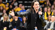 Former Iowa basketball star Caitlin Clark addresses the sellout crowd during a special jersey retirement ceremony. 