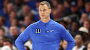 Nov 4, 2025; Charlotte, North Carolina, USA; Duke Blue Devils head coach Jon Scheyer watches the play against the Texas Longhorns during the first half of the Dick Vitale’s Invitational game at Spectrum Center. Mandatory Credit: Cory Knowlton-Imagn Images