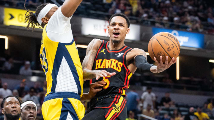 Ex-Husky guard Dejounte Murray, shown driving on the Pacers, has been traded from Atlanta to New Orleans. 
