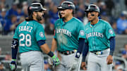 Oct 13, 2025; Toronto, Ontario, CAN; Seattle Mariners infielder Josh Naylor (12) celebrates a two run home run in the seventh inning against the Toronto Blue Jays during game two of the ALCS round for the 2025 MLB playoffs at Rogers Centre. Mandatory Credit: Nick Turchiaro-Imagn Images