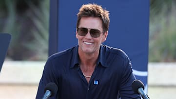 Aug 8, 2025; Foxborough, Massachusetts, USA; Retired New England Patriot Hall of Famer Tom Brady speaks during a statue unveiling before a game against the Washington Commanders at Gillette Stadium. Mandatory Credit: Paul Rutherford-Imagn Images