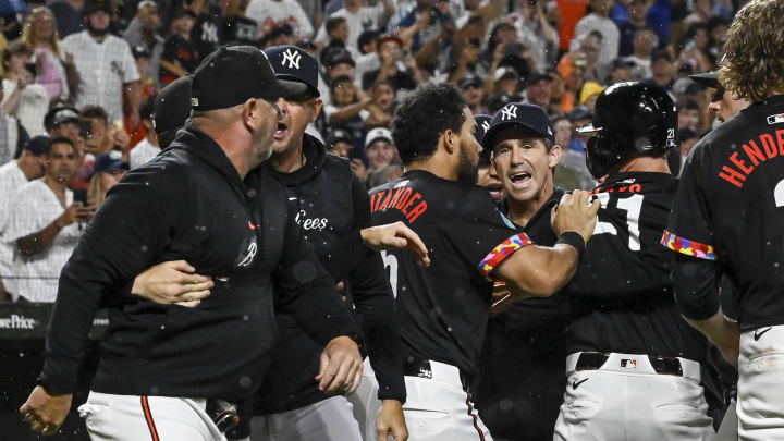 Jul 12, 2024; Baltimore, Maryland, USA; New York Yankees bench coach Brad Ausmus (68) and Baltimore Orioles manager Brandon Hyde (18) exchange words during the ninth inning  at Oriole Park at Camden Yards. Mandatory Credit: Tommy Gilligan-USA TODAY Sports