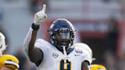 Dec 30, 2023; Tucson, AZ, USA; Toledo Rockets defensive tackle Darius Alexander (9) against the Wyoming Cowboys in the Arizona Bowl at Arizona Stadium. Mandatory Credit: Mark J. Rebilas-USA TODAY Sports