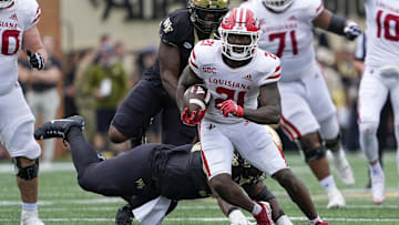 Sep 28, 2024; Winston-Salem, North Carolina, USA; Louisiana-Lafayette Ragin Cajuns running back Zylan Perry (21) runs for yards against the Wake Forest Demon Deacons during the first half at Allegacy Federal Credit Union Stadium. Mandatory Credit: Jim Dedmon-Imagn Images