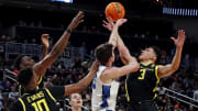 Mar 23, 2024; Pittsburgh, PA, USA; Oregon Ducks guard Jackson Shelstad (3) and Creighton Bluejays forward Mason Miller (13) go for a rebound during the first half in the second round of the 2024 NCAA Tournament at PPG Paints Arena. Mandatory Credit: Charles LeClaire-USA TODAY Sports