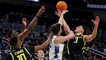 Mar 23, 2024; Pittsburgh, PA, USA; Oregon Ducks guard Jackson Shelstad (3) and Creighton Bluejays forward Mason Miller (13) go for a rebound during the first half in the second round of the 2024 NCAA Tournament at PPG Paints Arena. Mandatory Credit: Charles LeClaire-USA TODAY Sports