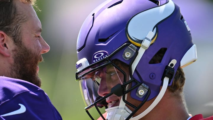 Aug 2, 2024; Eagan, MN, USA; Minnesota Vikings quarterback J.J. McCarthy (9) greets center Michael Jurgens (65) during practice at Vikings training camp in Eagan, MN. Mandatory Credit: Jeffrey Becker-USA TODAY Sports