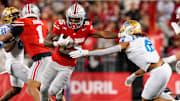Ohio State Buckeyes running back Bo Jackson (25) stiff arms UCLA Bruins linebacker Donavyn Pellot (0) in the second half of the NCAA college football game at Ohio Stadium on Saturday, Nov. 15, 2025 in Columbus, Ohio.