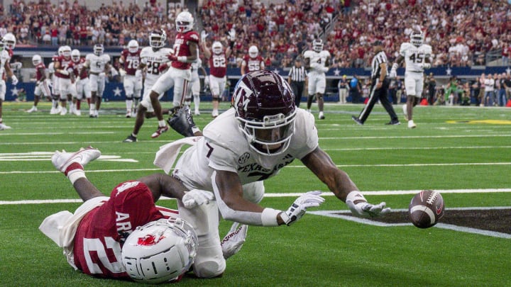 Sep 30, 2023; Arlington, Texas, USA; Texas A&M Aggies defensive back Tyreek Chappell (7) breaks up a pass intended for Arkansas Razorbacks wide receiver Andrew Armstrong (2) during the second half at AT&T Stadium. Mandatory Credit: Jerome Miron-USA TODAY Sports