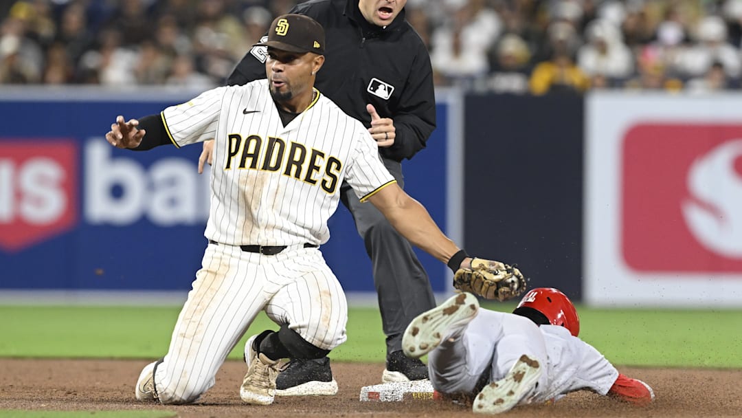 May 7, 2026; San Diego, California, USA; St. Louis Cardinals center fielder Victor Scott II (11) is tagged out by San Diego Padres shortstop Xander Bogaerts (2) as he tries to steal second base during the eighth inning at Petco Park. Mandatory Credit: Denis Poroy-Imagn Images