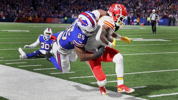 Kansas City Chiefs running back Isiah Pacheco (10) is tackled near the sideline by Buffalo Bills linebacker Tyrel Dodson (25)