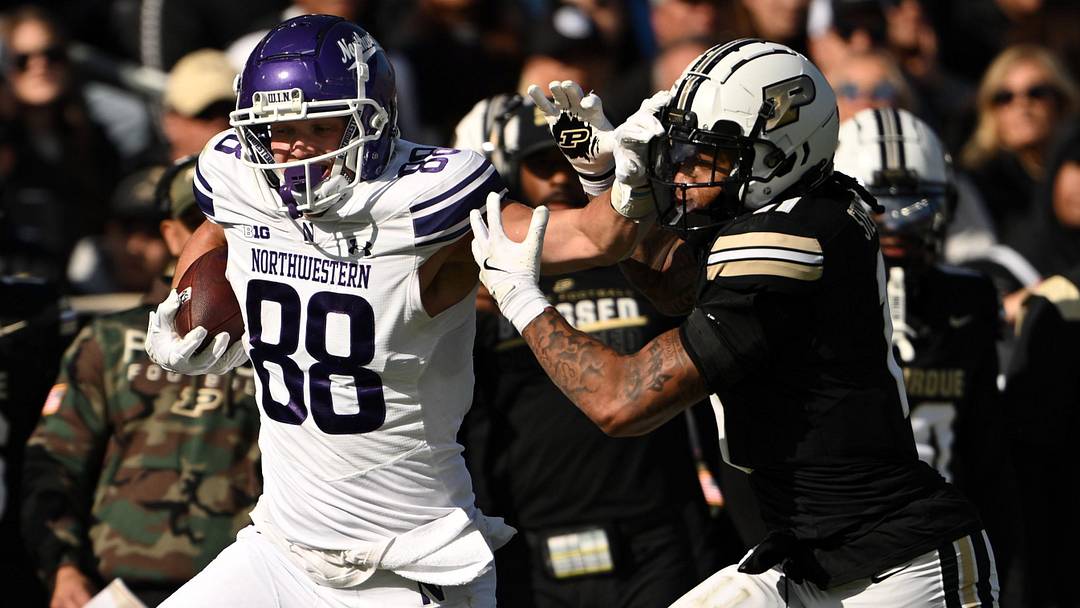 Nov 2, 2024; West Lafayette, Indiana, USA; Northwestern Wildcats tight end Marshall Lang (88) pushes away Purdue Boilermakers defensive back Antonio Stevens (11) during the second quarter at Ross-Ade Stadium. 