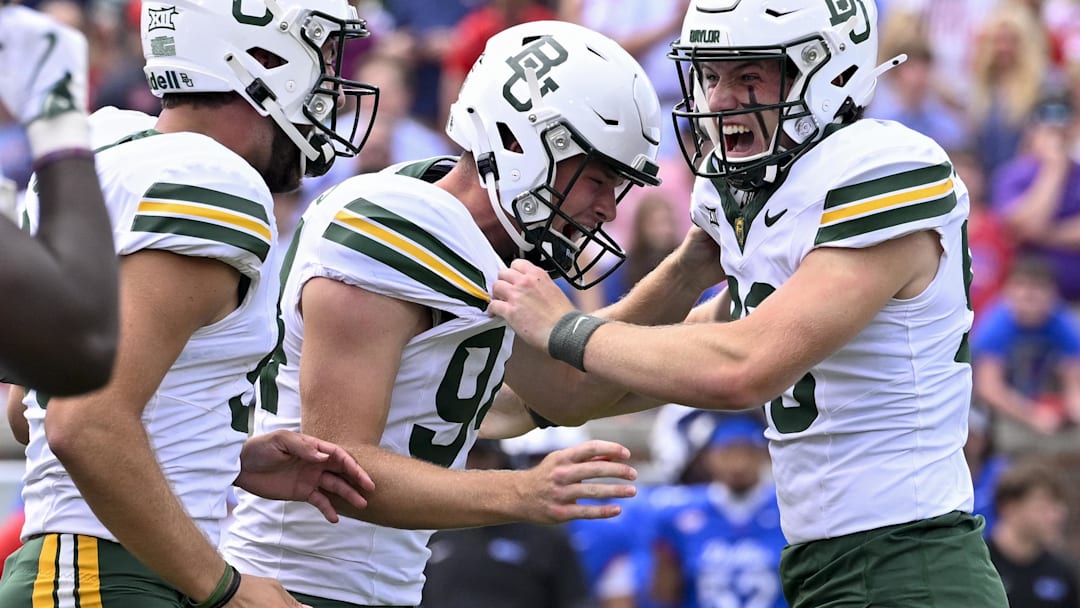 Sep 6, 2025; Dallas, Texas, USA; Baylor Bears punter Palmer Williams (94) celebrates after place kicker Connor Hawkins (96) makes a game winning field goal to defeat the SMU Mustangs during the second overtime at Gerald J. Ford Stadium. Mandatory Credit: Jerome Miron-Imagn Images