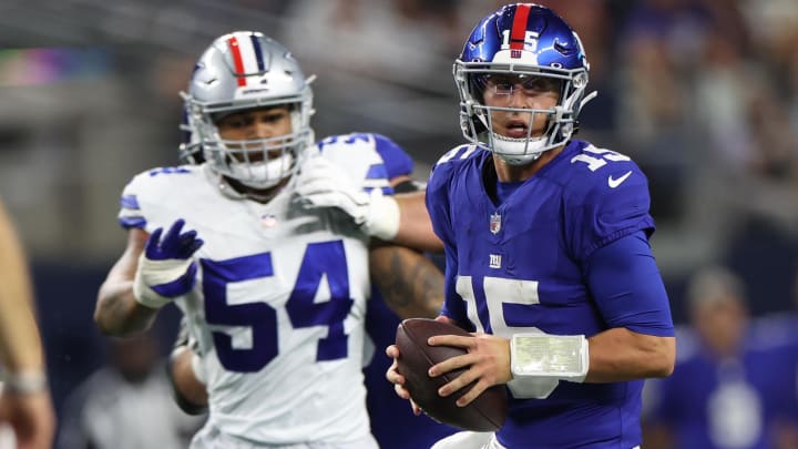 Nov 12, 2023; Arlington, Texas, USA;  New York Giants quarterback Tommy DeVito (15) looks to pass as Dallas Cowboys defensive end Sam Williams (54) chases during the second quarter at AT&T Stadium.  