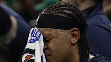 Orlando Magic forward Paolo Banchero (5) wipes his face during a timeout in the second half of game two of the first round of the 2024 NBA Playoffs against the Boston Celtics at TD Garden. 