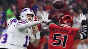 Nov 20, 2025; Houston, Texas, USA; Buffalo Bills quarterback Josh Allen (17) throws a pass against Houston Texans defensive end Will Anderson Jr. (51) in the first quarter at NRG Stadium.