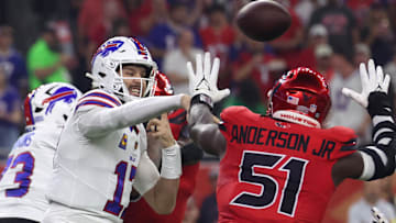 Nov 20, 2025; Houston, Texas, USA; Buffalo Bills quarterback Josh Allen (17) throws a pass against Houston Texans defensive end Will Anderson Jr. (51) in the first quarter at NRG Stadium.