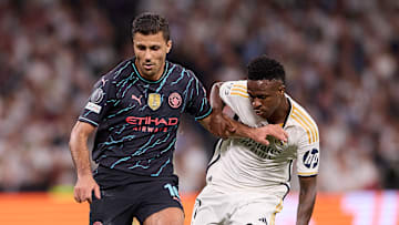 Rodrigo Hernandez Cascante, known as Rodri (L) of Manchester...