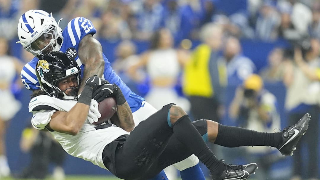Dec 28, 2025; Indianapolis, Indiana, USA; Jacksonville Jaguars wide receiver Jakobi Meyers (3) is tackled by Indianapolis Colts linebacker Germaine Pratt (53) during a game at Lucas Oil Stadium. 