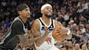 Apr 11, 2025; Minneapolis, Minnesota, USA; Minnesota Timberwolves forward Nickeil Alexander-Walker (9) works past Brooklyn Nets guard Keon Johnson (45) in the third quarter at Target Center. Mandatory Credit: Bruce Kluckhohn-Imagn Images