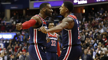 Nov 26, 2018; Washington, DC, USA; Washington Wizards guard John Wall (2) celebrates with Wizards guard Bradley Beal (3) against the Houston Rockets in overtime at Capital One Arena. The Wizards won 135-131 in overtime. Mandatory Credit: Geoff Burke-Imagn Images