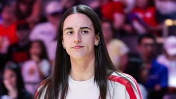 Aug 7, 2025; Phoenix, Arizona, USA; Indiana Fever injured guard Caitlin Clark in attendance against the Phoenix Mercury during an WNBA game at PHX Arena. Mandatory Credit: Mark J. Rebilas-Imagn Images