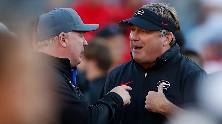 Georgia coach Kirby Smart speaks with Kentucky coach Mark Stoops before the start of a NCAA college football game against Kentucky in Athens, Ga., on Saturday, Oct. 7, 2023. Georgia coach Kirby Smart speaks with Kentucky coach Mark Stoops before the start of a NCAA college football game against Kentucky in Athens, Ga., on Saturday, Oct. 7, 2023.