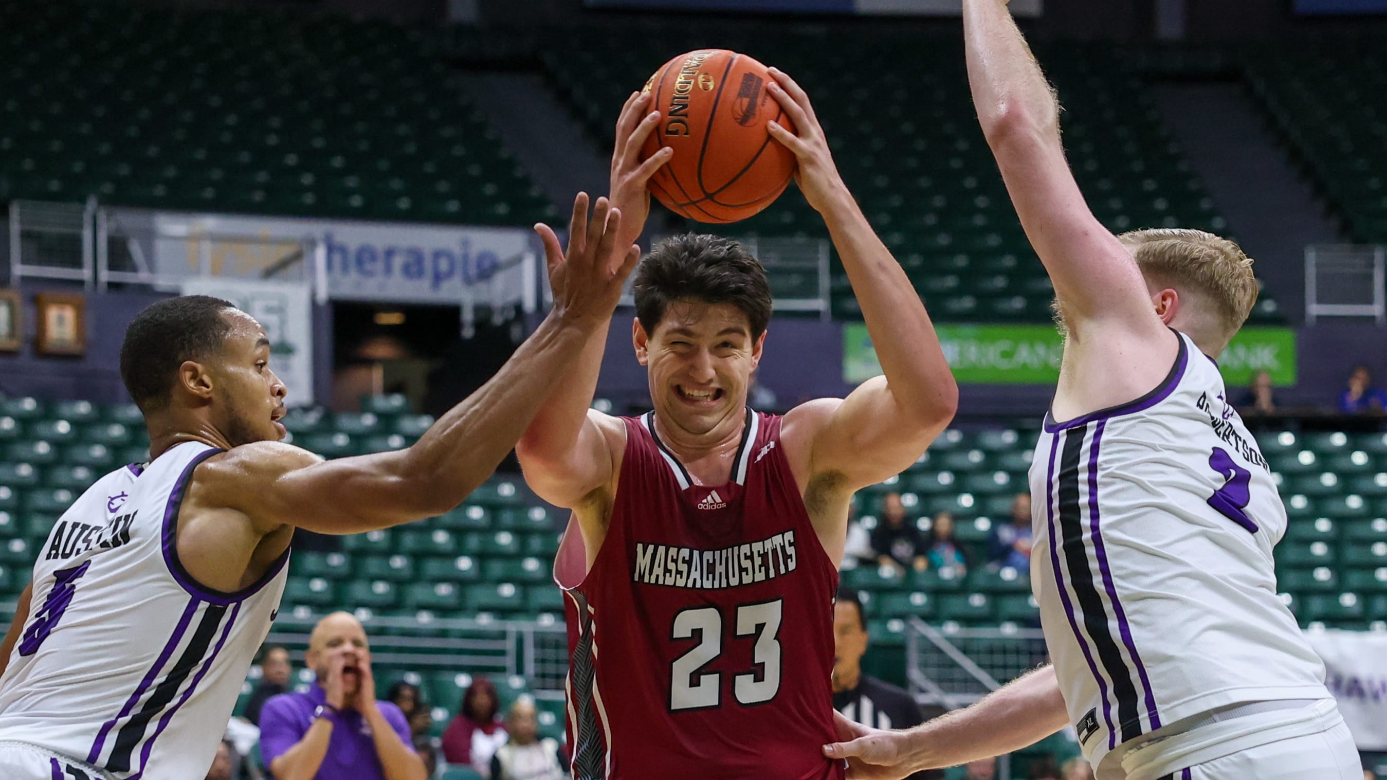 Josh Cohen of UMass drives inside in Hawaii tournament