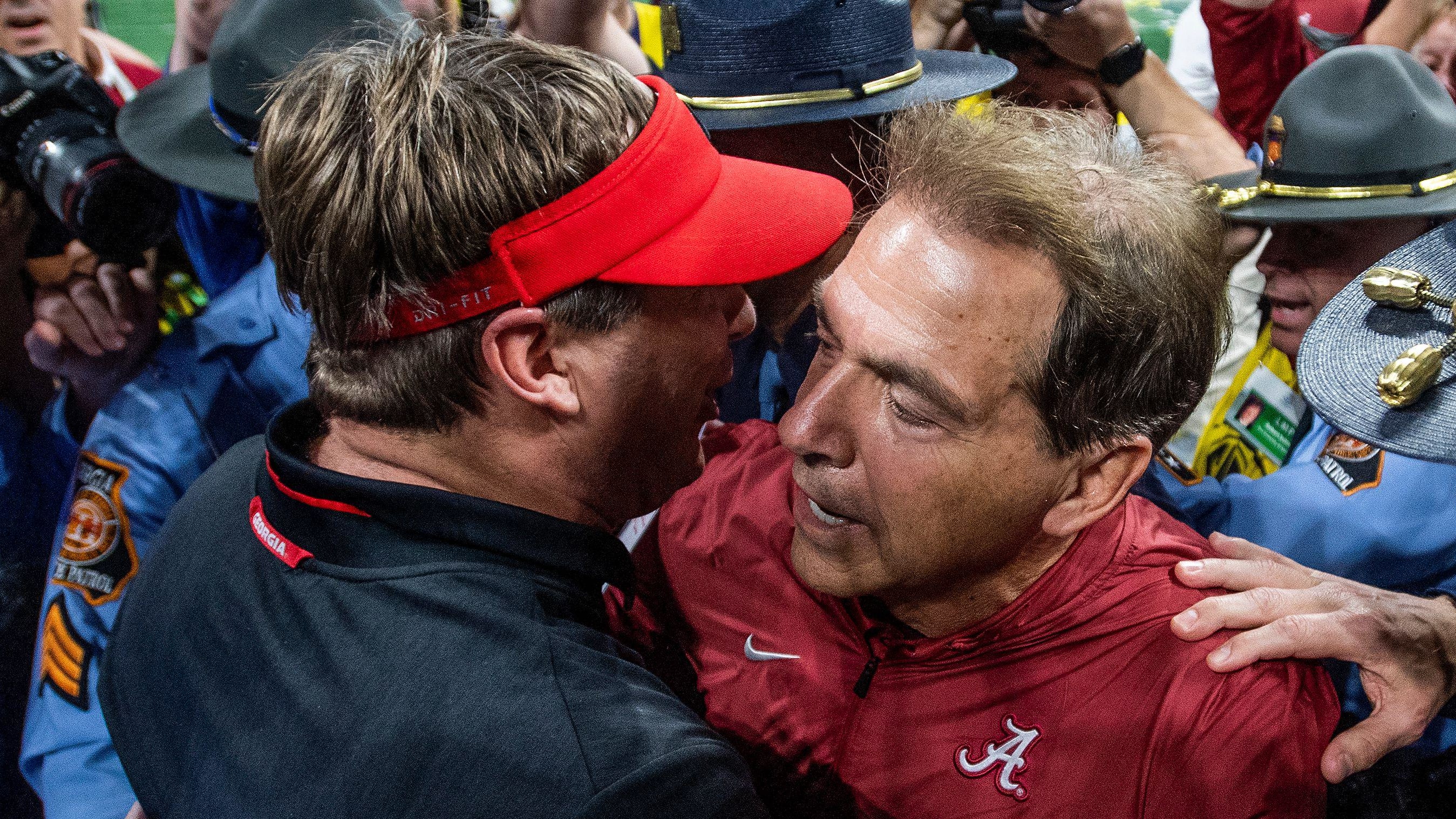 Kirby Smart and Nick Saban meet after the SEC Championship Game during the college football postseason.