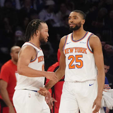 Feb 20, 2025; New York, New York, USA; New York Knicks point guard Jalen Brunson (11) slaps hands with forward Mikal Bridges (25) after he made a play against the Chicago Bulls during the first half at Madison Square Garden. Mandatory Credit: Gregory Fisher-Imagn Images