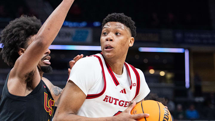 Mar 12, 2025; Indianapolis, IN, USA;  Rutgers Scarlet Knights guard Ace Bailey (4) shoots the ball while USC Trojans guard Kevin Patton Jr. (8) defends in the second half at Gainbridge Fieldhouse. Mandatory Credit: Trevor Ruszkowski-Imagn Images