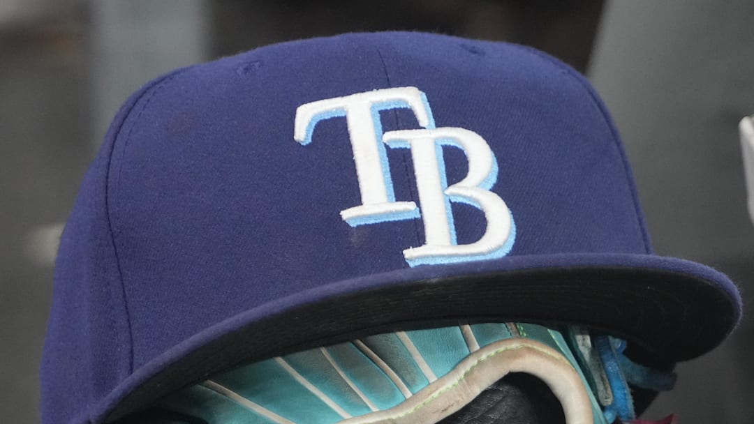 Sep 26, 2025; Toronto, Ontario, CAN; The hat and glove of Tampa Bay Rays third baseman Junior Caminero (13) in the dugout during the game against the Toronto Blue Jays at Rogers Centre. 