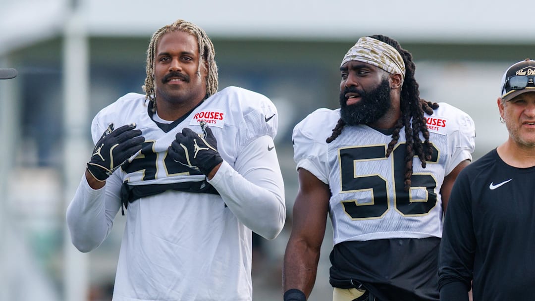 Jul 30, 2025; New Orleans, LA, USA;  New Orleans Saints defensive end Cameron Jordan (94) and linebacker Demario Davis (56) during training camp at Ochsner Sports Performance Center. Mandatory Credit: Stephen Lew-Imagn Images