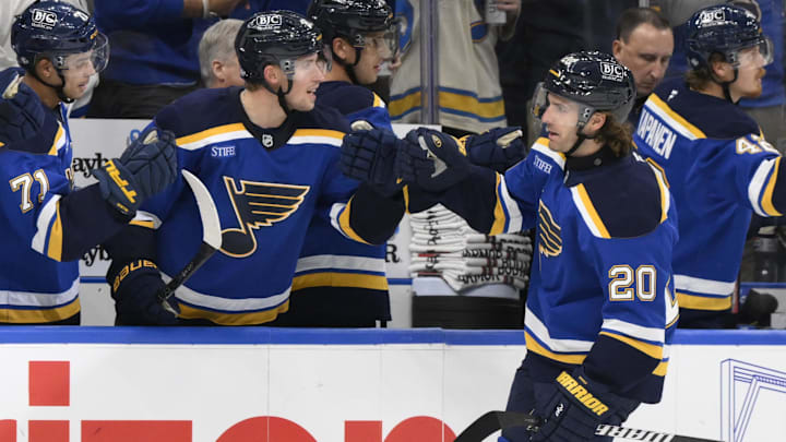 Oct 22, 2024; St. Louis, Missouri, USA; St. Louis Blues left wing Brandon Saad (20) is congratulated by teammates after scoring a goal against the Winnipeg Jets during the third period at Enterprise Center. Mandatory Credit: Jeff Le-Imagn Images 