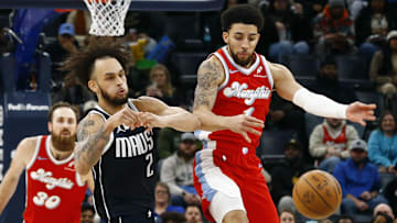 Jan 6, 2025; Memphis, Tennessee, USA; Memphis Grizzlies guard Scotty Pippen Jr. (1) steals the ball from Dallas Mavericks center Dereck Lively II (2) during the fourth quarter at FedExForum. Mandatory Credit: Petre Thomas-Imagn Images