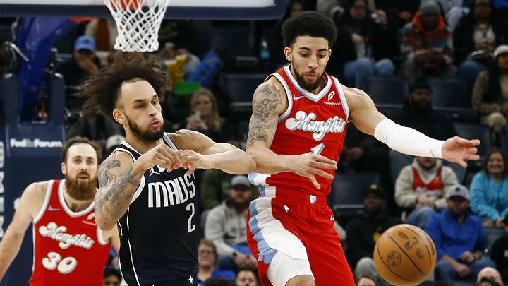 Jan 6, 2025; Memphis, Tennessee, USA; Memphis Grizzlies guard Scotty Pippen Jr. (1) steals the ball from Dallas Mavericks center Dereck Lively II (2) during the fourth quarter at FedExForum. Mandatory Credit: Petre Thomas-Imagn Images