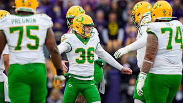 Oregon kicker Atticus "Automatic" Sappington celebrates a field goal with the field goal team. He hit four as the Ducks dropped Washington in Husky Stadium, 26-14.