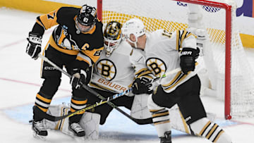 Apr 13, 2024; Pittsburgh, Pennsylvania, USA;  Pittsburgh Penguins center Sidney Crosby (87) pressures Boston Bruins goalie Linus Ullmark (35) near defenseman Kevin Shattenkirk (12) at PPG Paints Arena. Mandatory Credit: Philip G. Pavely-Imagn Images