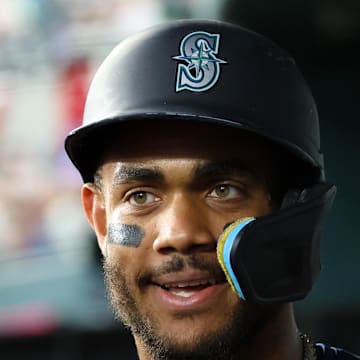 Seattle Mariners center fielder Julio Rodriguez (44) celebrates with teammates after scoring during the first inning against the Texas Rangers at Globe Life Field on June 27. 