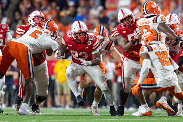 Nebraska running back Dante Dowdell rushes for a 7-yard gain against Illinois.