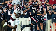 Nov 2, 2024; Columbia, South Carolina, USA; South Carolina Gamecocks tight end Joshua Simon (6) runs after a reception past Texas A&M Aggies defensive back Trey Jones III (9) in the second half at Williams-Brice Stadium. Mandatory Credit: Jeff Blake-Imagn Images