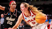 Mar 21, 2025; Columbia, South Carolina, USA; Utah Utes guard Gianna Kneepkens (5) drives past Indiana Hoosiers guard Chloe Moore-McNeil (22) in the second half at Colonial Life Arena. Mandatory Credit: Jeff Blake-Imagn Images