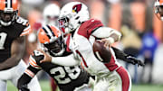 Oct 17, 2021; Cleveland, Ohio, USA; Arizona Cardinals quarterback Kyler Murray (1) scrambles from Cleveland Browns outside linebacker Jeremiah Owusu-Koramoah (28) during the second half at FirstEnergy Stadium. Mandatory Credit: Ken Blaze-Imagn Images