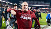 Nov 16, 2024; Columbia, South Carolina, USA; South Carolina Gamecocks head coach Shane Beamer celebrates beating the Missouri Tigers at Williams-Brice Stadium. He is holding the Mayors Cup, given to the winner of the South Carolina-Missouri game. Mandatory Credit: Jeff Blake-Imagn Images